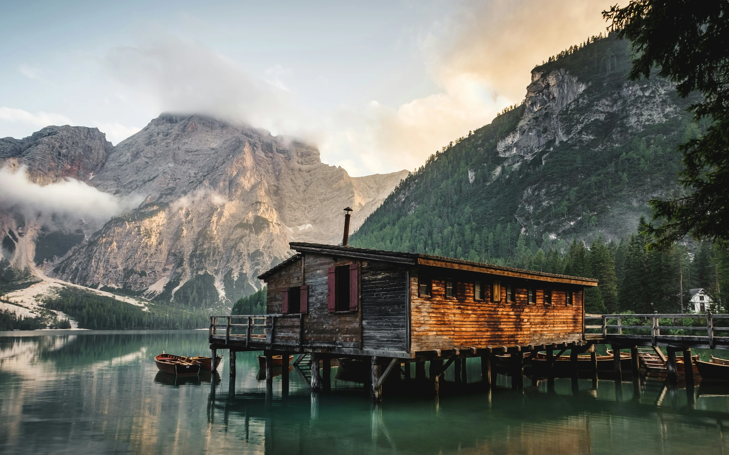 Lakeside boathouse beneath the mountains