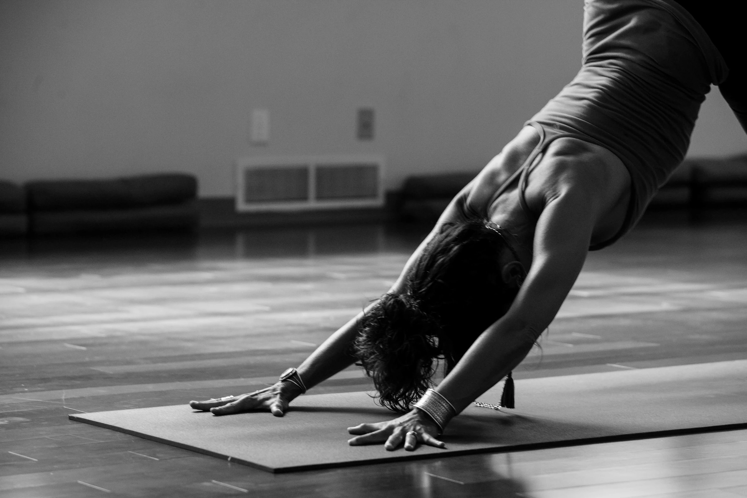 A yoga practitioner in downward dog pose